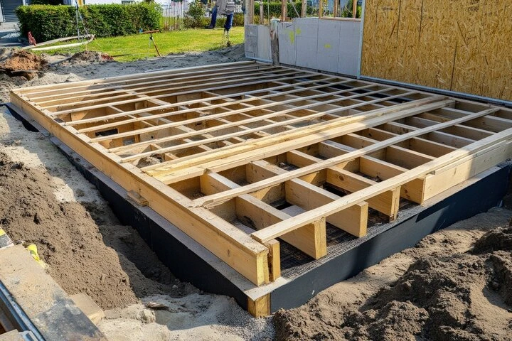 Natural wood deck construction in Orlando featuring pressure treated lumber and outdoor seating